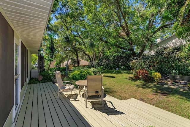 wooden terrace with a yard