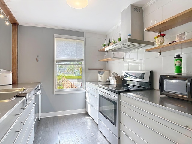 kitchen featuring baseboards, open shelves, island exhaust hood, decorative backsplash, and stainless steel range with electric stovetop