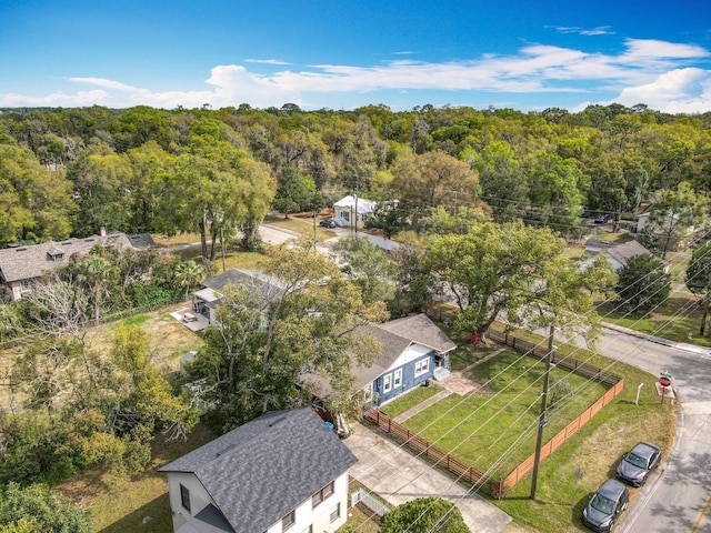 birds eye view of property with a wooded view