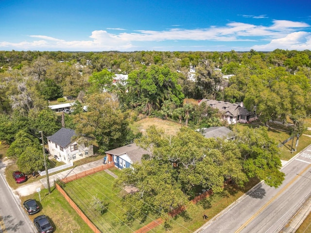 drone / aerial view featuring a view of trees