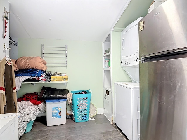 washroom with laundry area and stacked washing maching and dryer