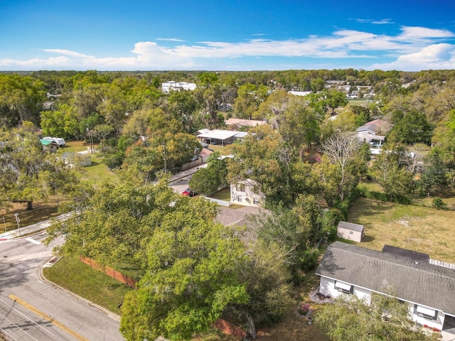 bird's eye view featuring a wooded view