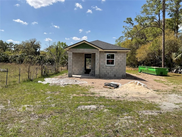 exterior space featuring an outbuilding and fence