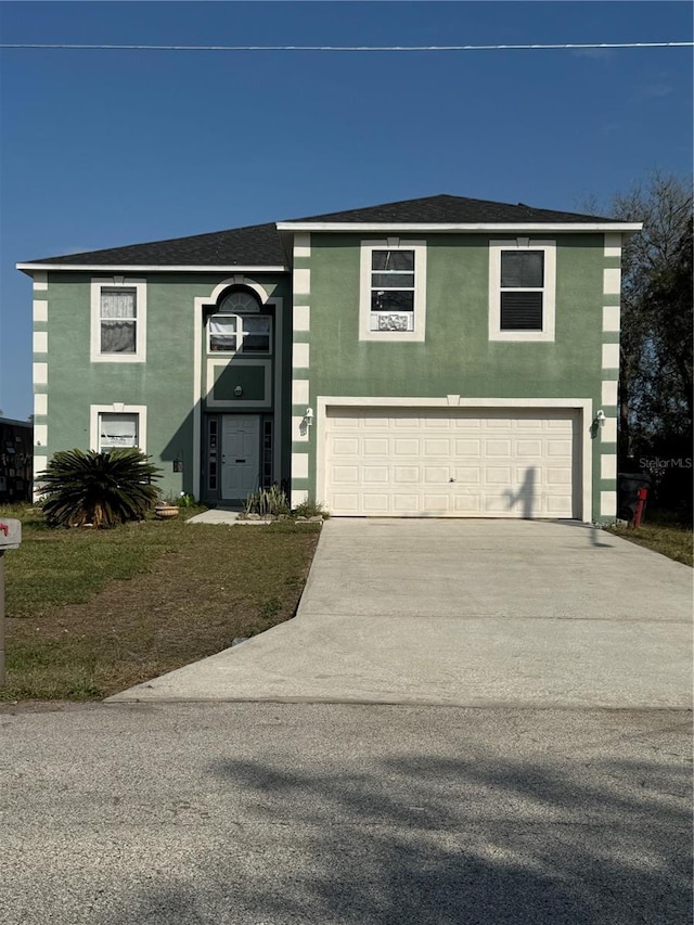 view of front facade featuring stucco siding, driveway, a garage, and roof with shingles