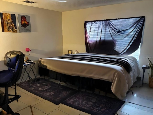 tiled bedroom featuring visible vents