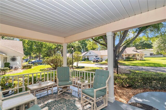8787 SW 90th Ln Unit E, Ocala, FL 34481 - view of patio featuring a residential view and a porch