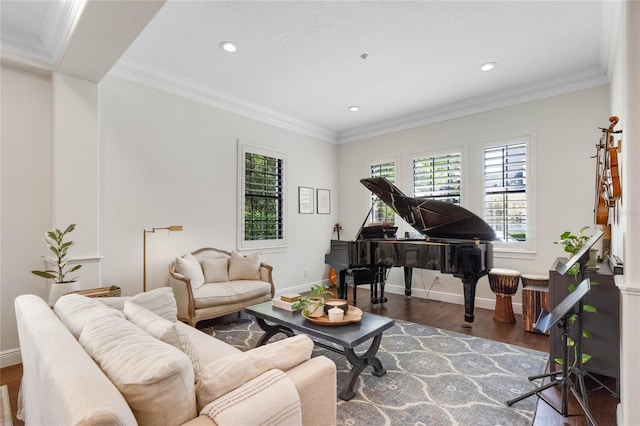 living room featuring wood finished floors, baseboards, and ornamental molding