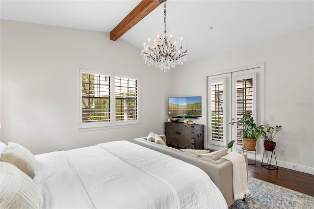 bedroom featuring an inviting chandelier, access to exterior, multiple windows, and wood finished floors