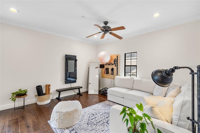 living room featuring ornamental molding, a ceiling fan, recessed lighting, wood-type flooring, and baseboards