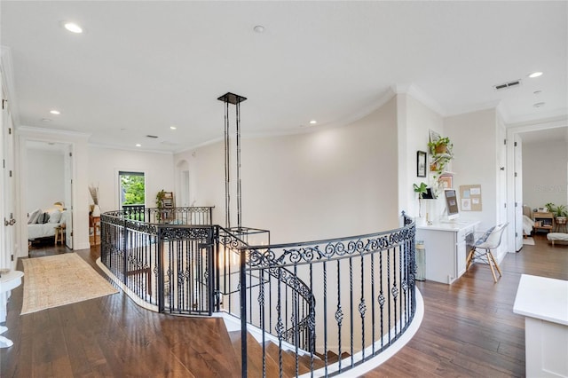 corridor with wood finished floors, recessed lighting, an upstairs landing, and visible vents