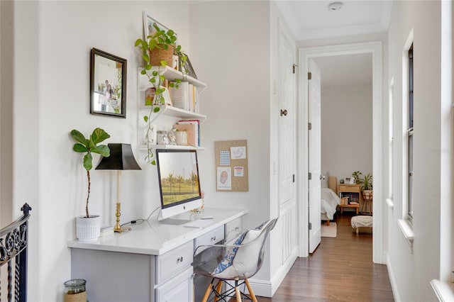 office space with wood finished floors and baseboards