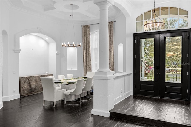 foyer with coffered ceiling, an inviting chandelier, ornamental molding, french doors, and wood-type flooring