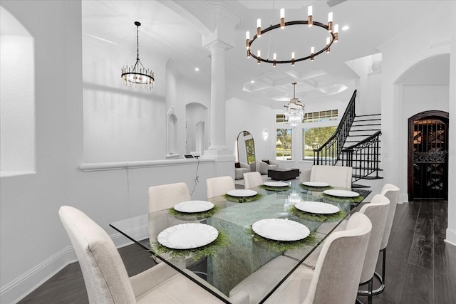 dining space featuring a notable chandelier, stairway, baseboards, and dark wood-style flooring