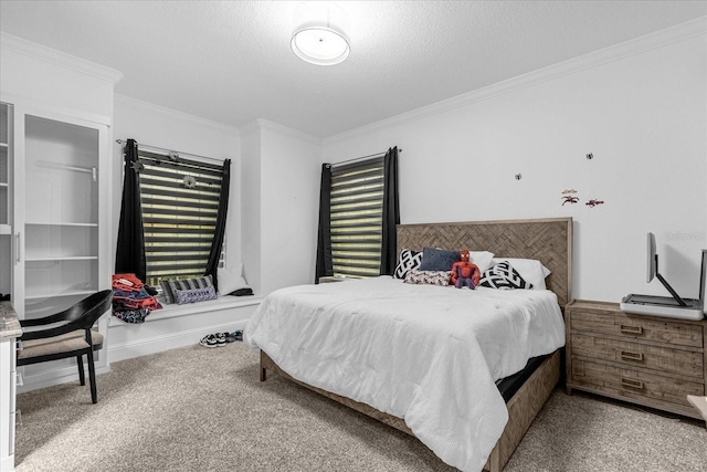 carpeted bedroom featuring crown molding, baseboards, and a textured ceiling