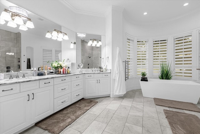 full bath with crown molding, double vanity, a tile shower, a soaking tub, and a notable chandelier