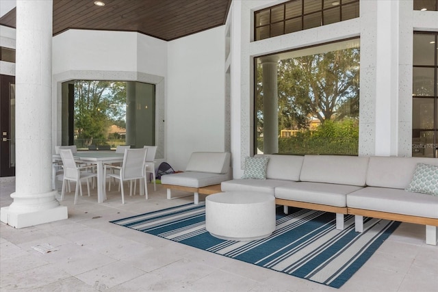 view of patio / terrace with outdoor dining space and an outdoor living space