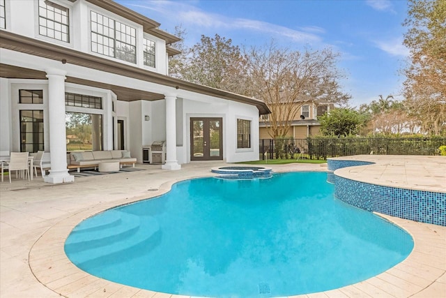 view of swimming pool featuring french doors, fence, outdoor lounge area, and a patio area