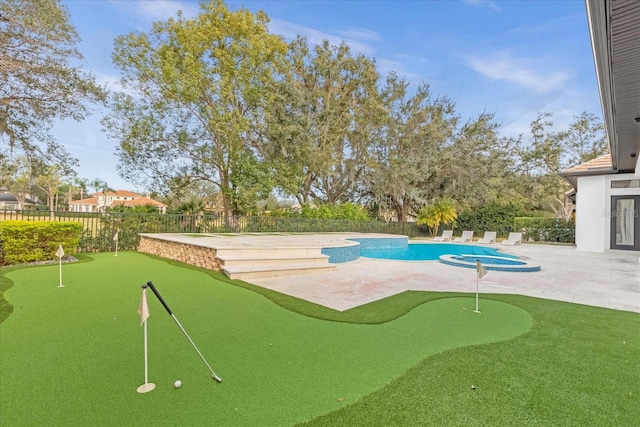 view of property's community featuring a patio area, a swimming pool, a jacuzzi, and a fenced backyard