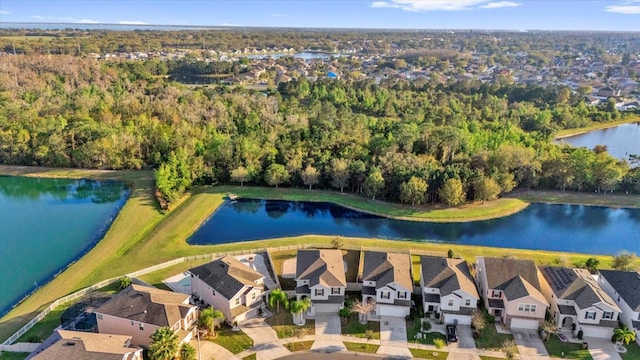 bird's eye view with a residential view and a water view