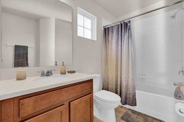 bathroom with vanity, toilet, and shower / bath combo with shower curtain