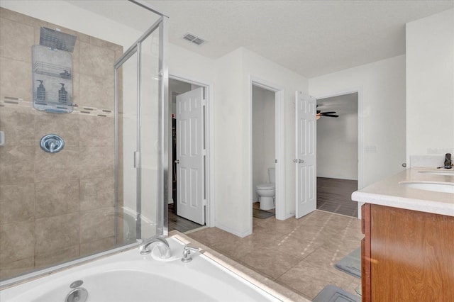 bathroom featuring a bath, visible vents, tile patterned flooring, a shower stall, and toilet