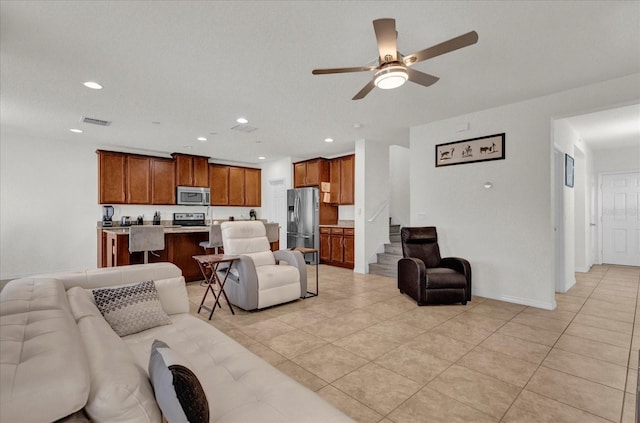 living room with recessed lighting, visible vents, light tile patterned flooring, and ceiling fan