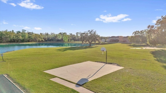 exterior space with a lawn, a patio, and a water view