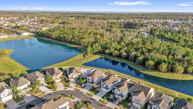 drone / aerial view featuring a residential view and a water view