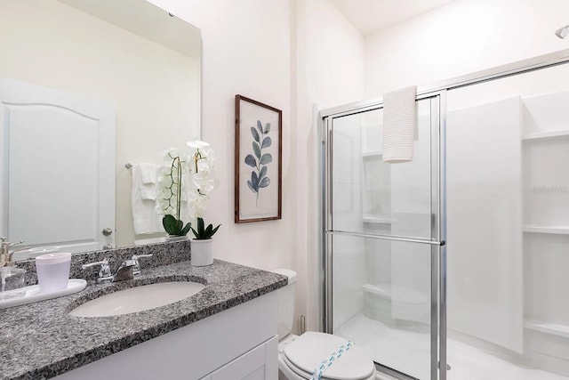 full bathroom featuring vanity, toilet, and a stall shower