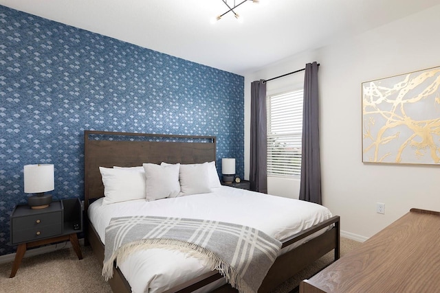 bedroom featuring baseboards, carpet flooring, and wallpapered walls