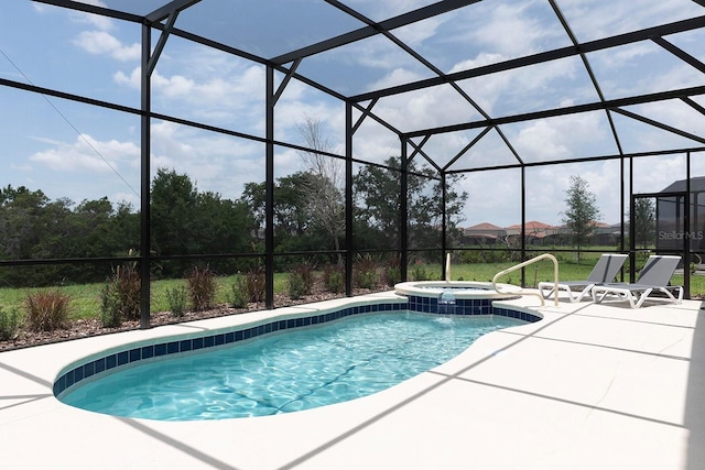 view of pool with glass enclosure, a patio, and a pool with connected hot tub