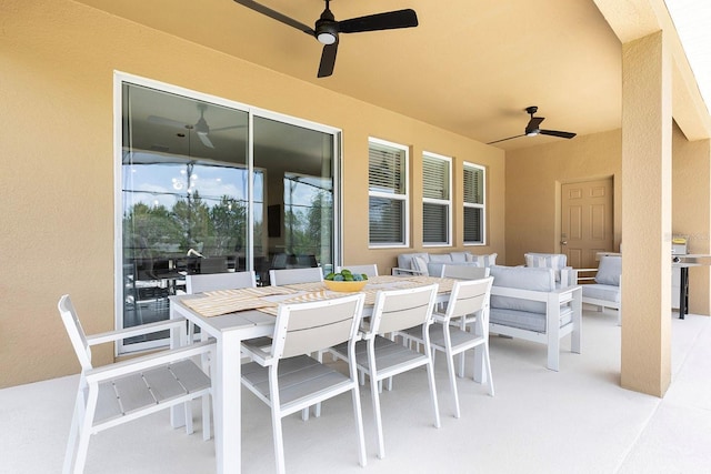 view of patio featuring outdoor dining area, ceiling fan, and outdoor lounge area