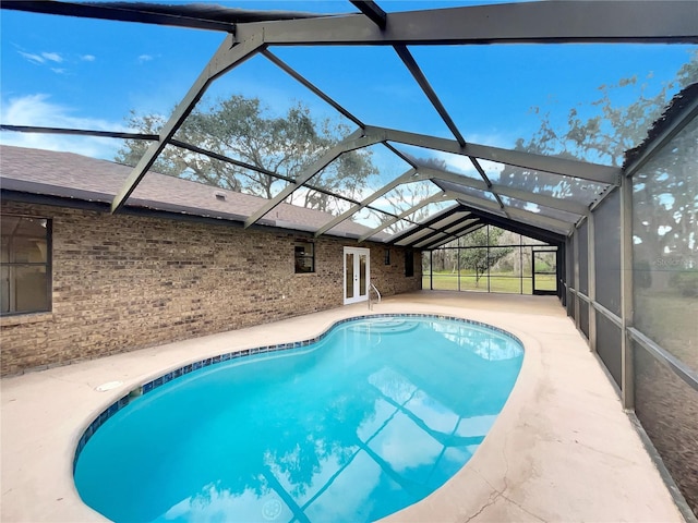 outdoor pool featuring a patio and a lanai