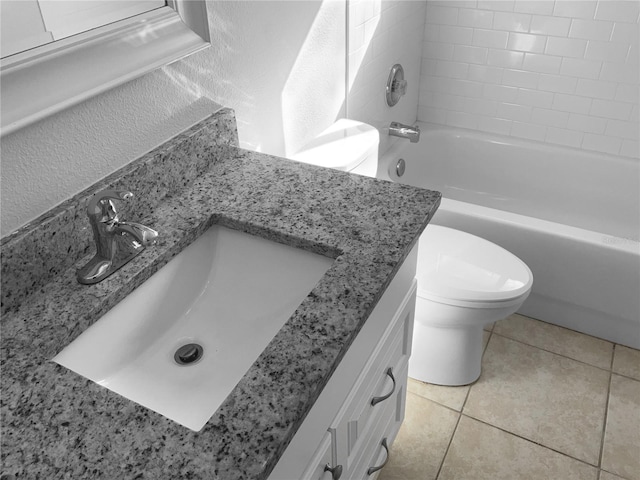 full bathroom featuring toilet, shower / bathtub combination, a textured wall, tile patterned floors, and vanity