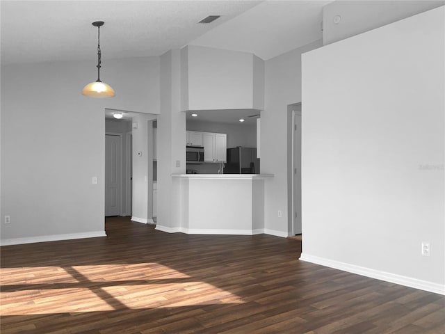 unfurnished living room with visible vents, baseboards, high vaulted ceiling, and dark wood-style floors