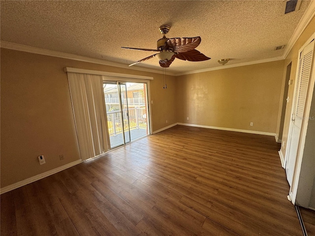 interior space featuring a textured ceiling, wood finished floors, baseboards, and ornamental molding