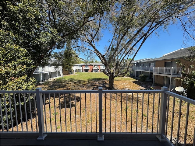 exterior space featuring a residential view and a balcony