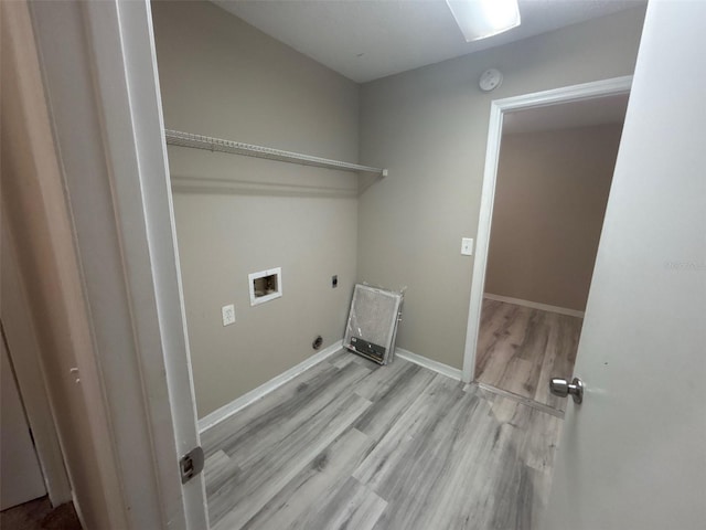 laundry area featuring wood finished floors, baseboards, hookup for an electric dryer, hookup for a washing machine, and laundry area