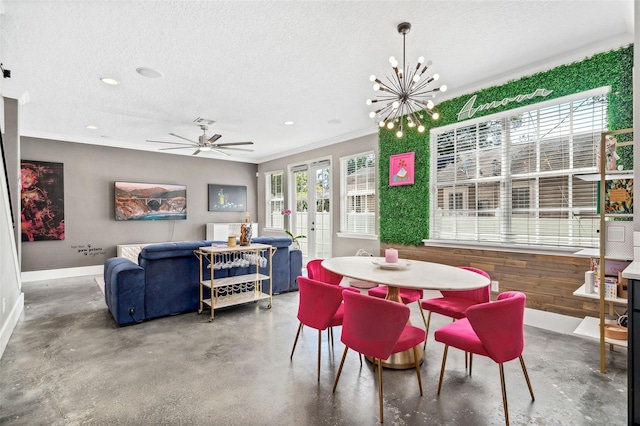 dining space with french doors, baseboards, concrete flooring, and a textured ceiling