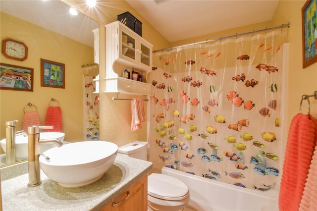 bathroom featuring shower / bathtub combination with curtain, toilet, and vanity