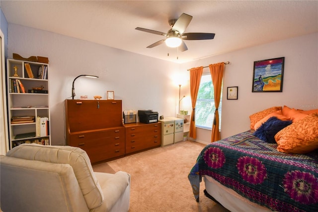 bedroom with ceiling fan and light carpet