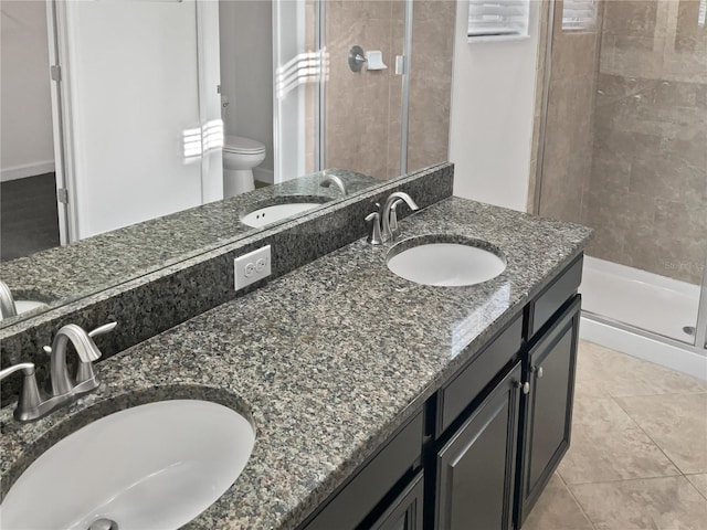 bathroom featuring a sink and a stall shower