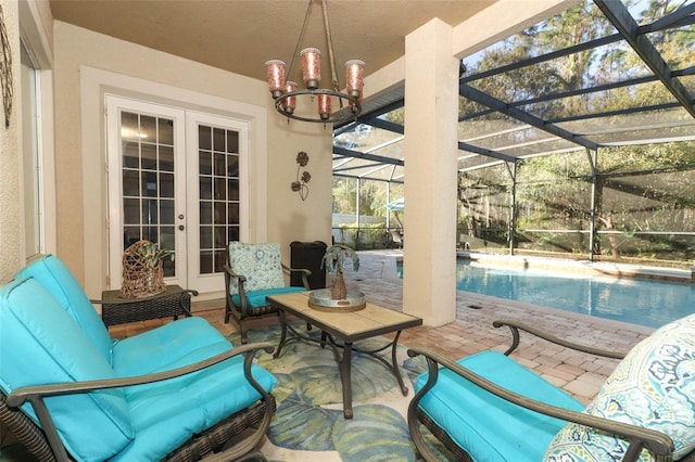 view of patio / terrace featuring a lanai, an outdoor pool, french doors, and outdoor lounge area