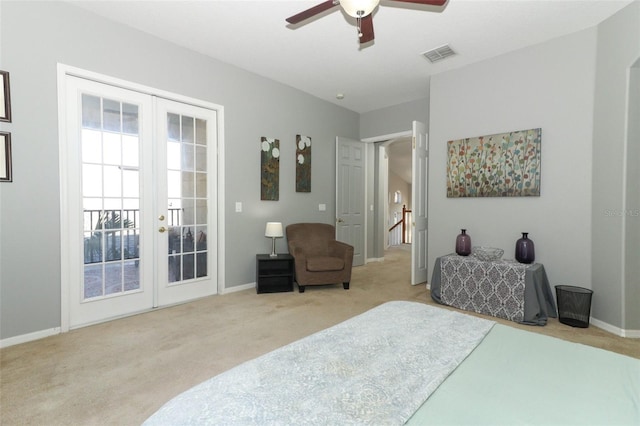 carpeted bedroom with visible vents, baseboards, french doors, a ceiling fan, and access to outside