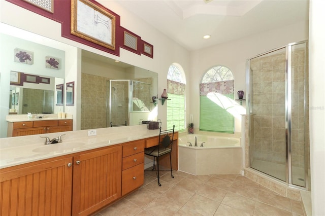 full bath featuring vanity, a shower stall, a bath, and tile patterned floors