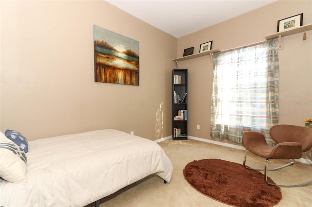 bedroom featuring carpet flooring and baseboards