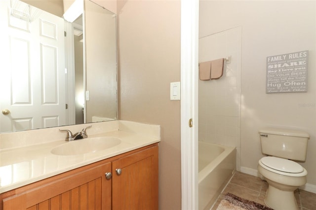 bathroom featuring tile patterned floors, baseboards, toilet, and vanity