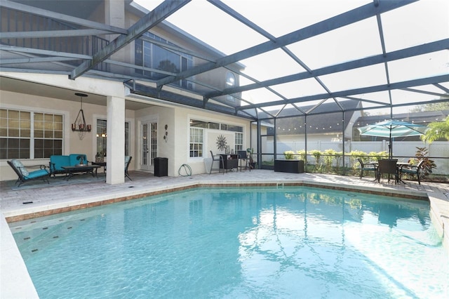 view of pool with a patio area, a fenced in pool, glass enclosure, and fence