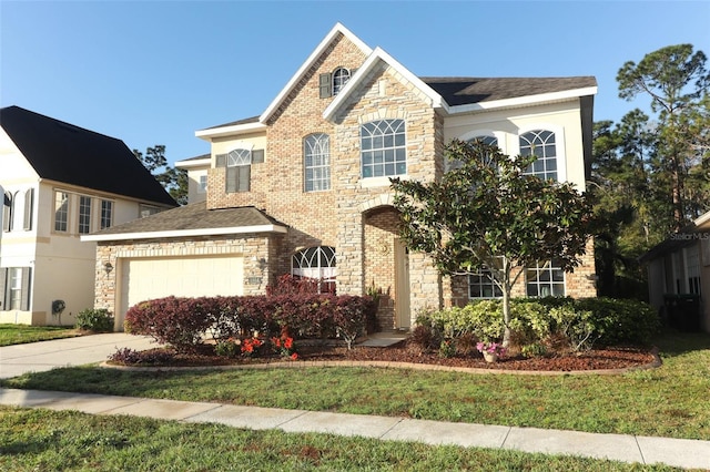 traditional home with stone siding and driveway