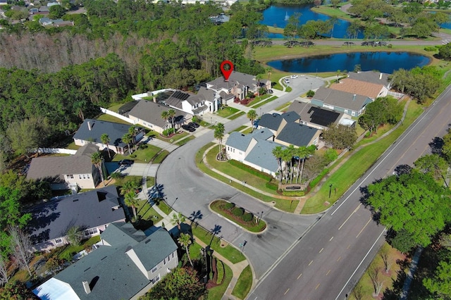 drone / aerial view with a residential view and a water view